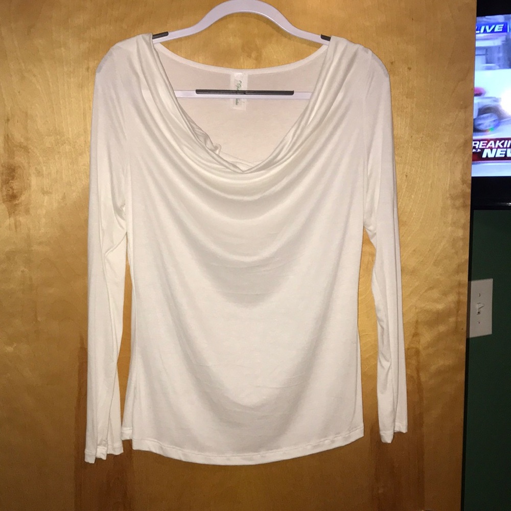 Never worn .White blouse. Longsleeve